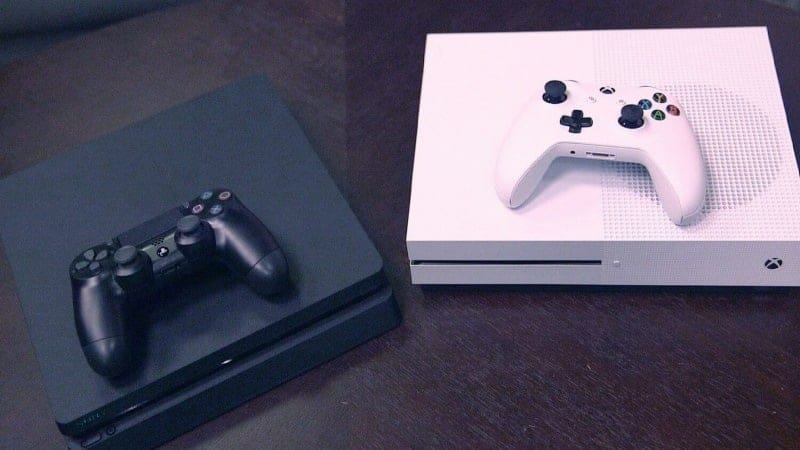 Two consoles - black and white