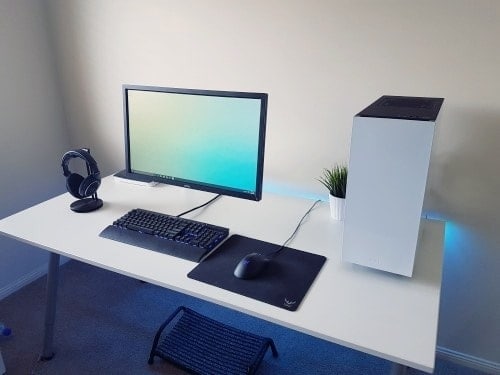 Computer is on the white table