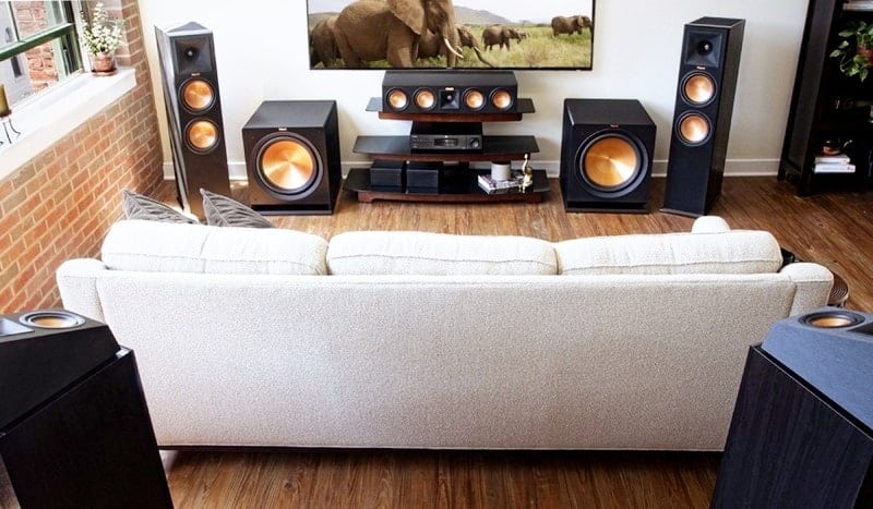 Sound system and a white sofa are in the living room